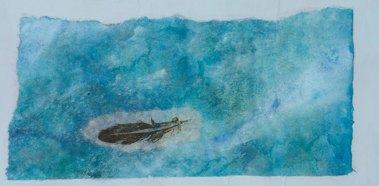A textured blue watercolour painting with patches of light and dark shades. A delicate brown feather lies slightly off-centre, creating a tranquil, airy feel.